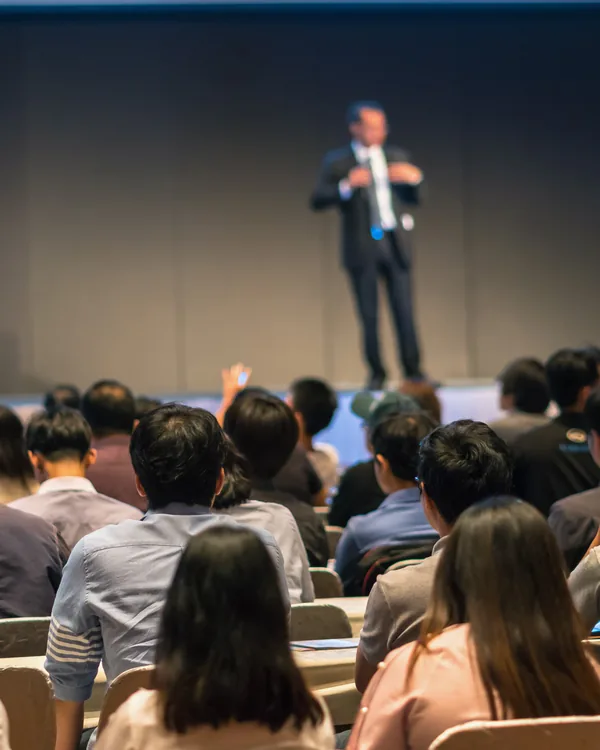 An audience at a low-light talk